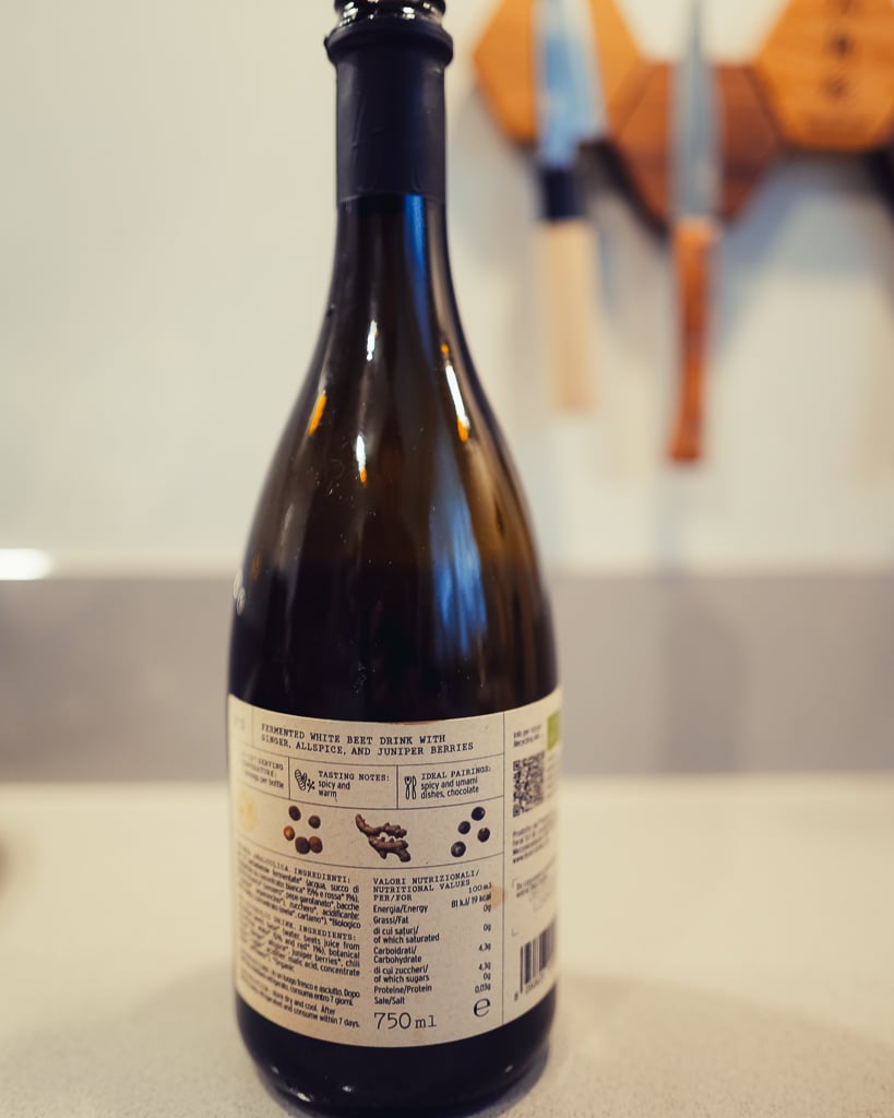 Back of a Feral 750 ml bottle showing the fermented beet drink ingredient and pairing details