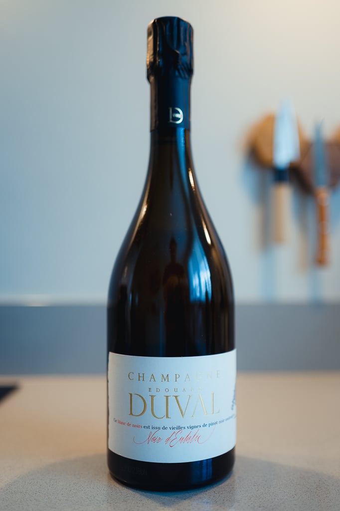 Edouard Duval Noir d'Eulalie dark bottle with cream label standing on a counter