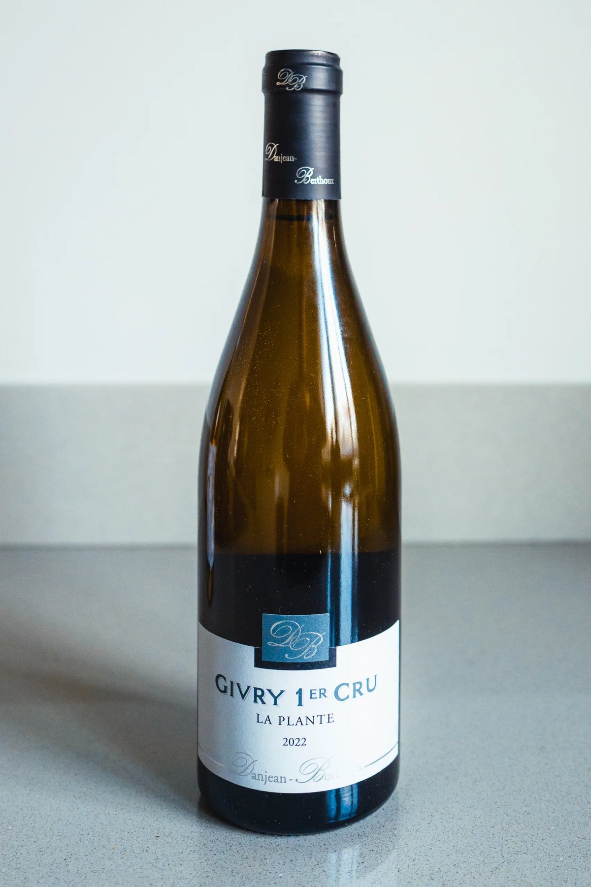 Danjean Berthoux Givry 1er Cru La Plante white wine bottle standing on a counter