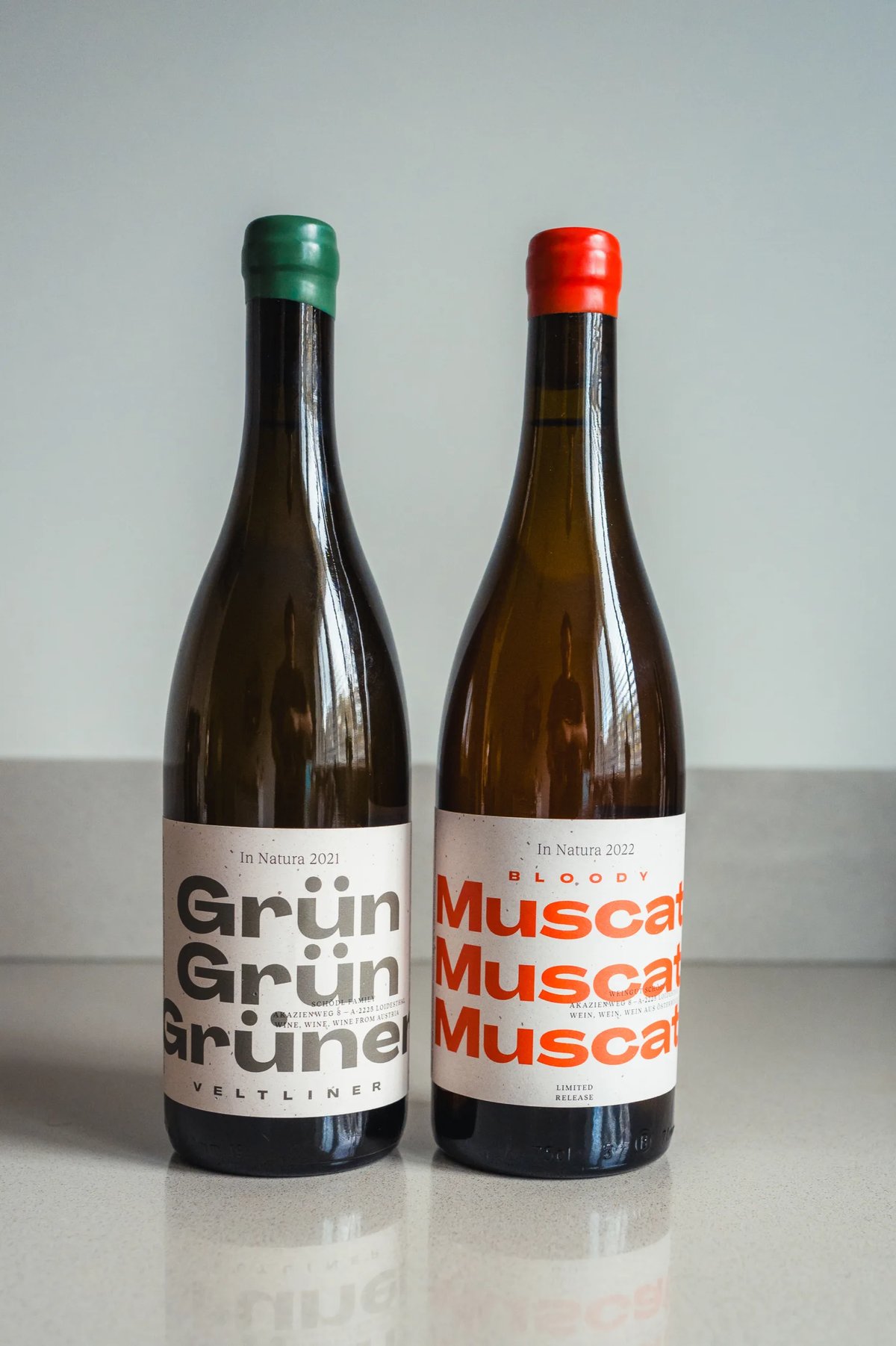 Schödl Grün Grün Grüner Veltliner and Bloody Muscat bottles standing side by side
