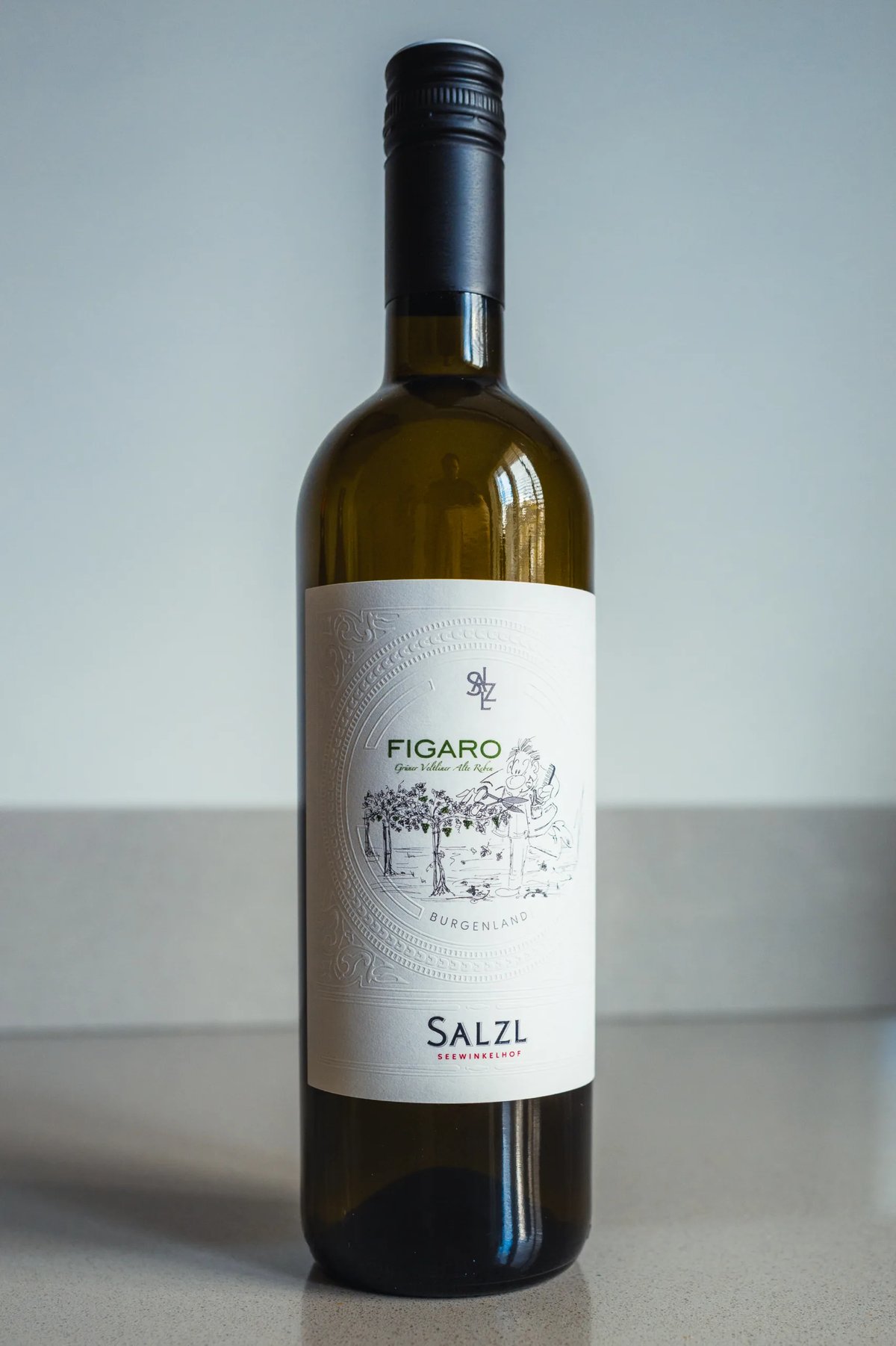 Salzl Figaro Grüner Veltliner bottle with cream label standing on a counter