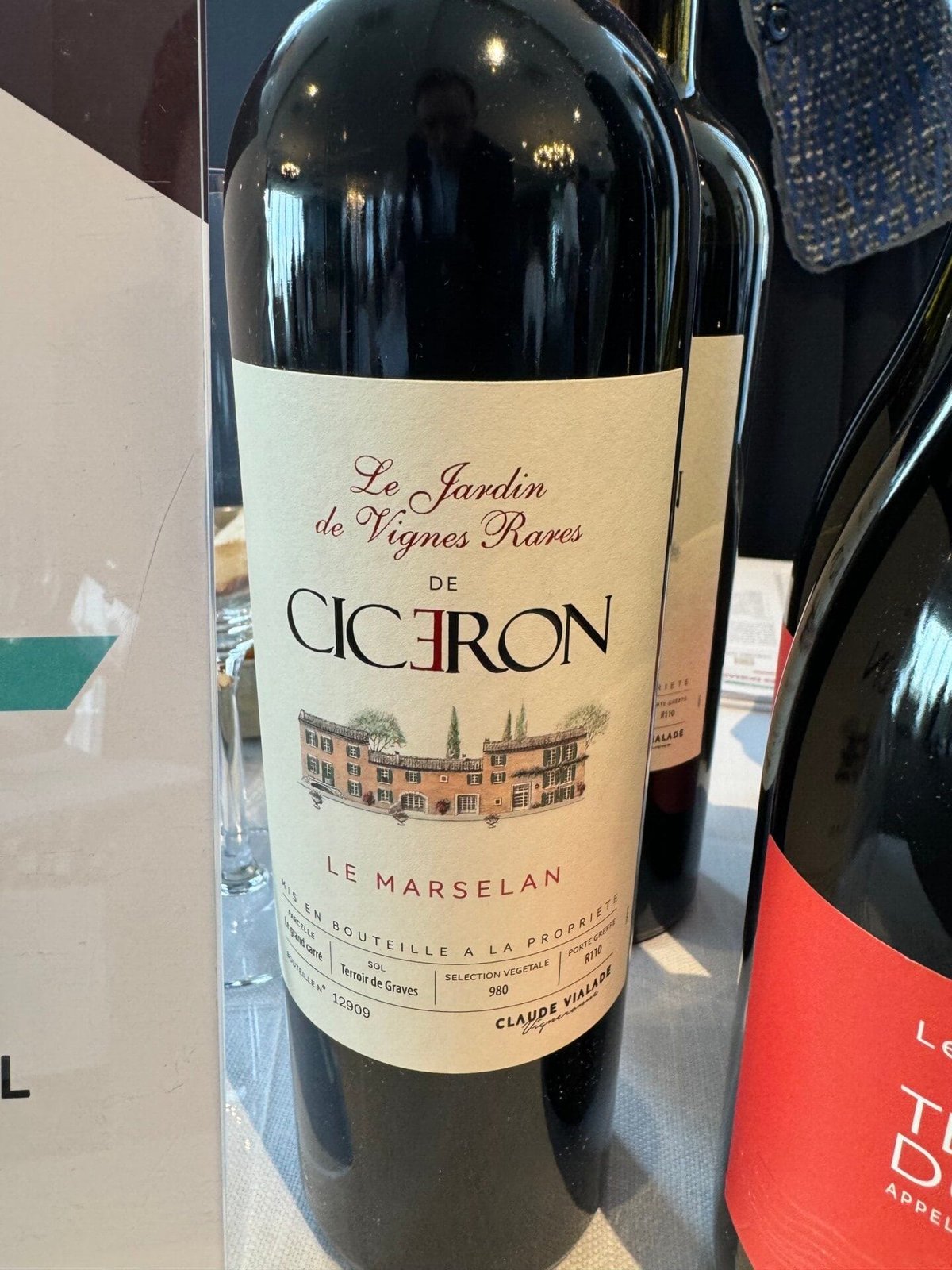 Bottle of Le Jardin de Vignes Rares de Cicéron Le Marselan red wine on a tasting table