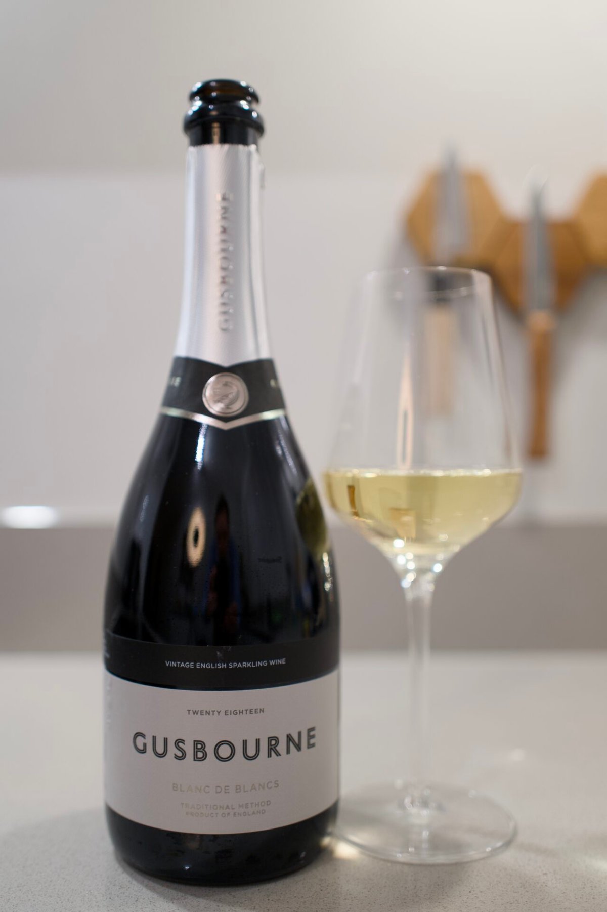 Four Gusbourne sparkling wine bottles lined up in a row, the full core range