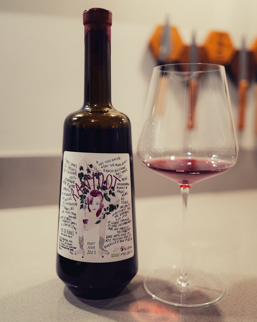 Cloudy Pet'Gab'La pet-nat bottle with illustrated label beside a glass of hazy orange wine