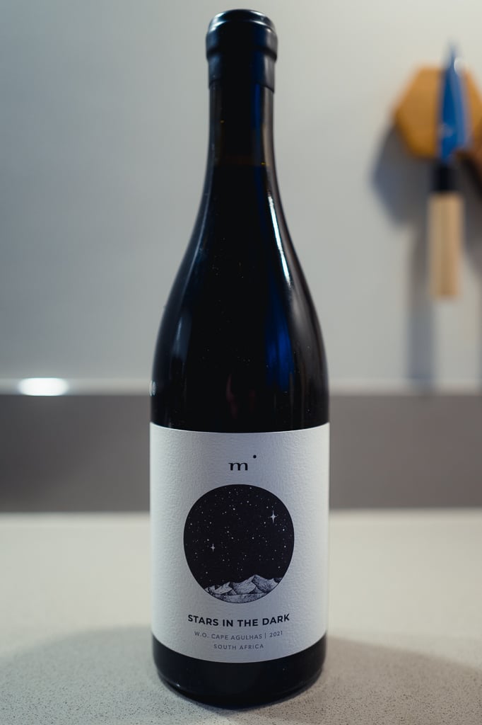 Minimalist Wines Stars in the Dark bottle standing alone on a counter