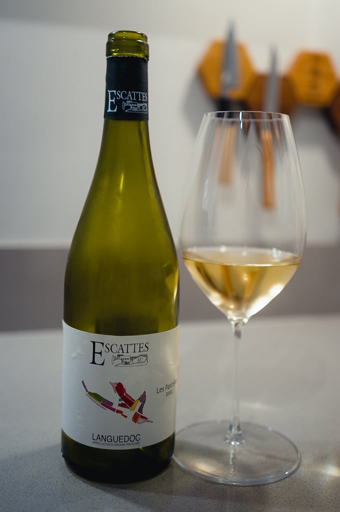 Escattes Languedoc white wine bottle beside a glass of pale golden wine