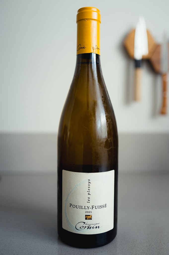 Bottle of Dominique Cornin Pouilly-Fuissé Les Plessys 2021 with a yellow capsule