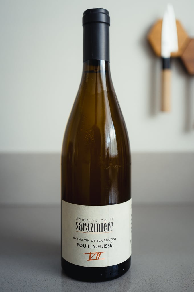 Bottle of Domaine de la Sarazinière Pouilly-Fuissé VII on a grey table