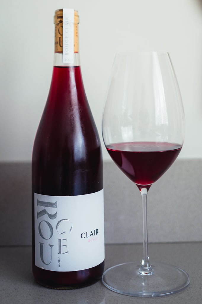 M. Chapoutier Rouge Clair bottle beside a glass of bright translucent red wine