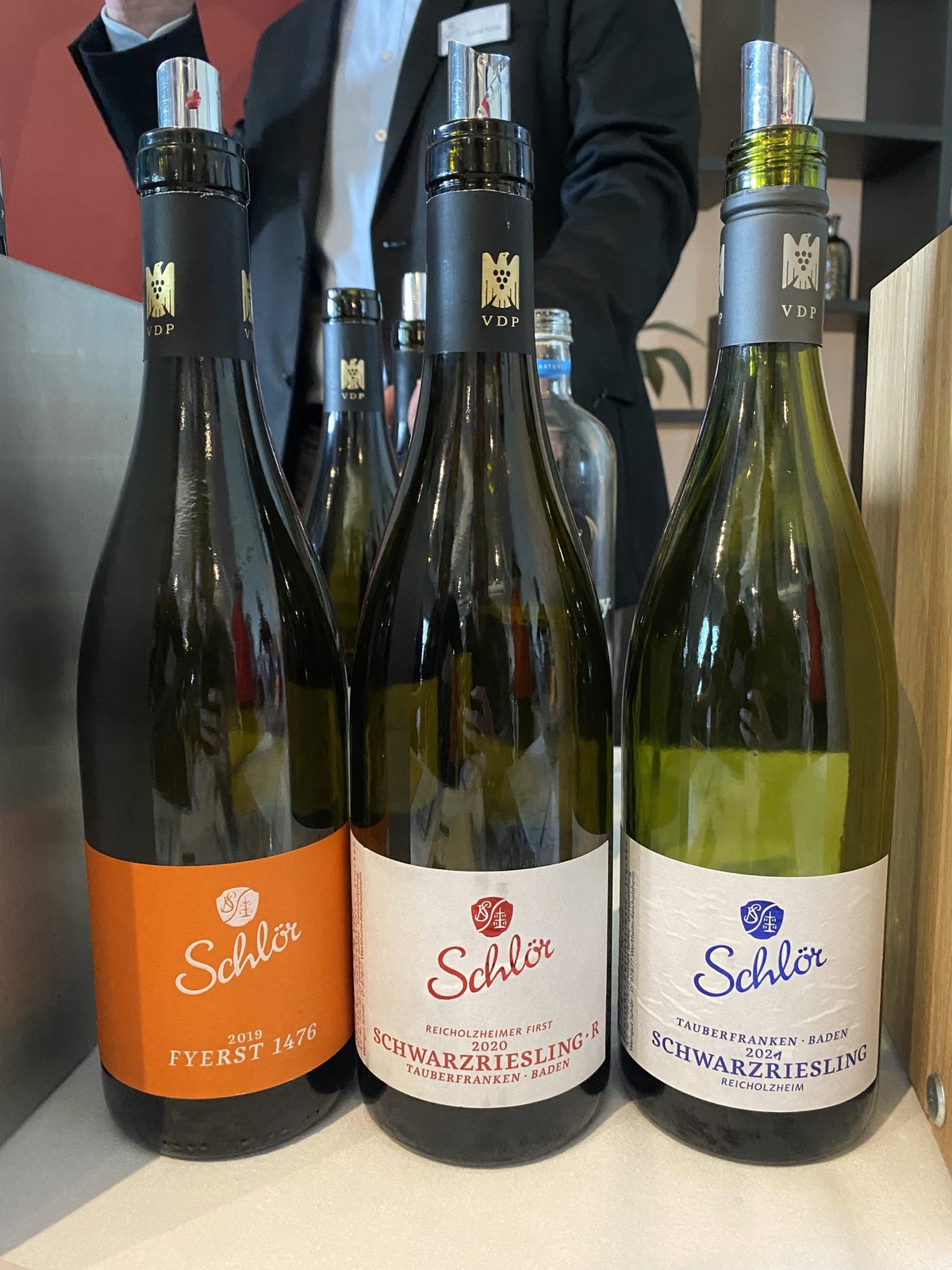 Three Schlör bottles with pourers, including a Fyerst and two Schwarzriesling from Tauberfranken