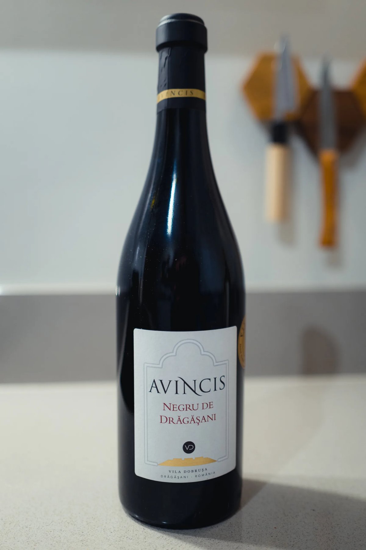 Avincis Negru de Dragasani red wine bottle standing on a kitchen counter