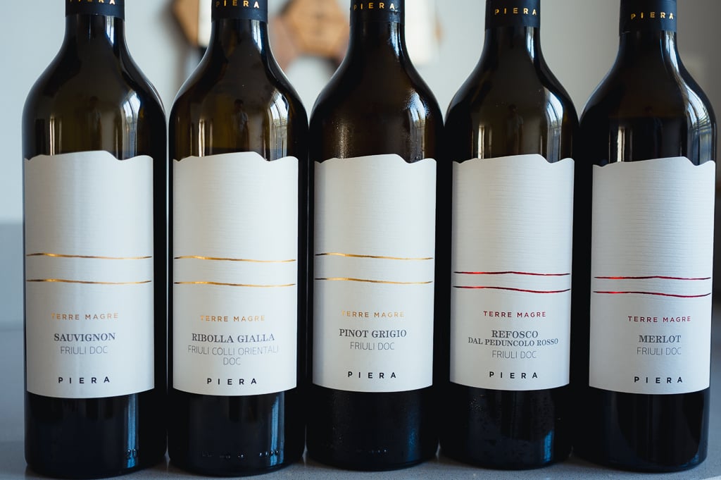 Close-up of five Piera Terre Magre bottles lined up showing their labels