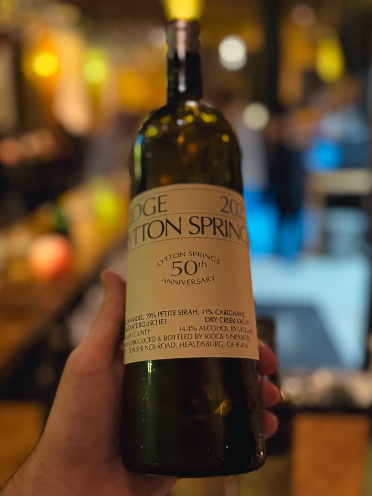 Hand holding the Ridge Lytton Springs 50th Anniversary bottle at the tasting