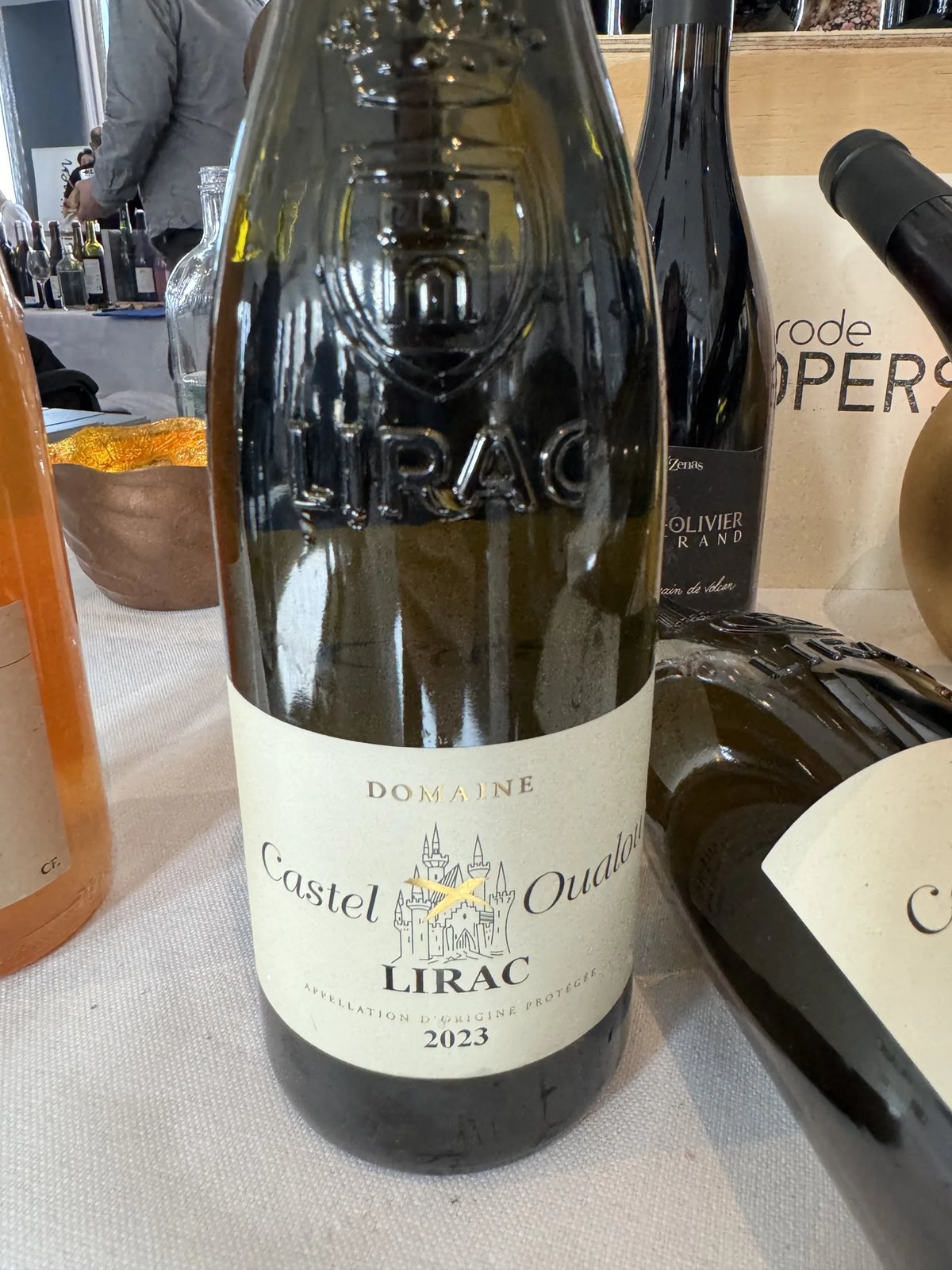 Domaine Castel Oualou Lirac 2023 bottle with an embossed shoulder and a castle drawing on the label