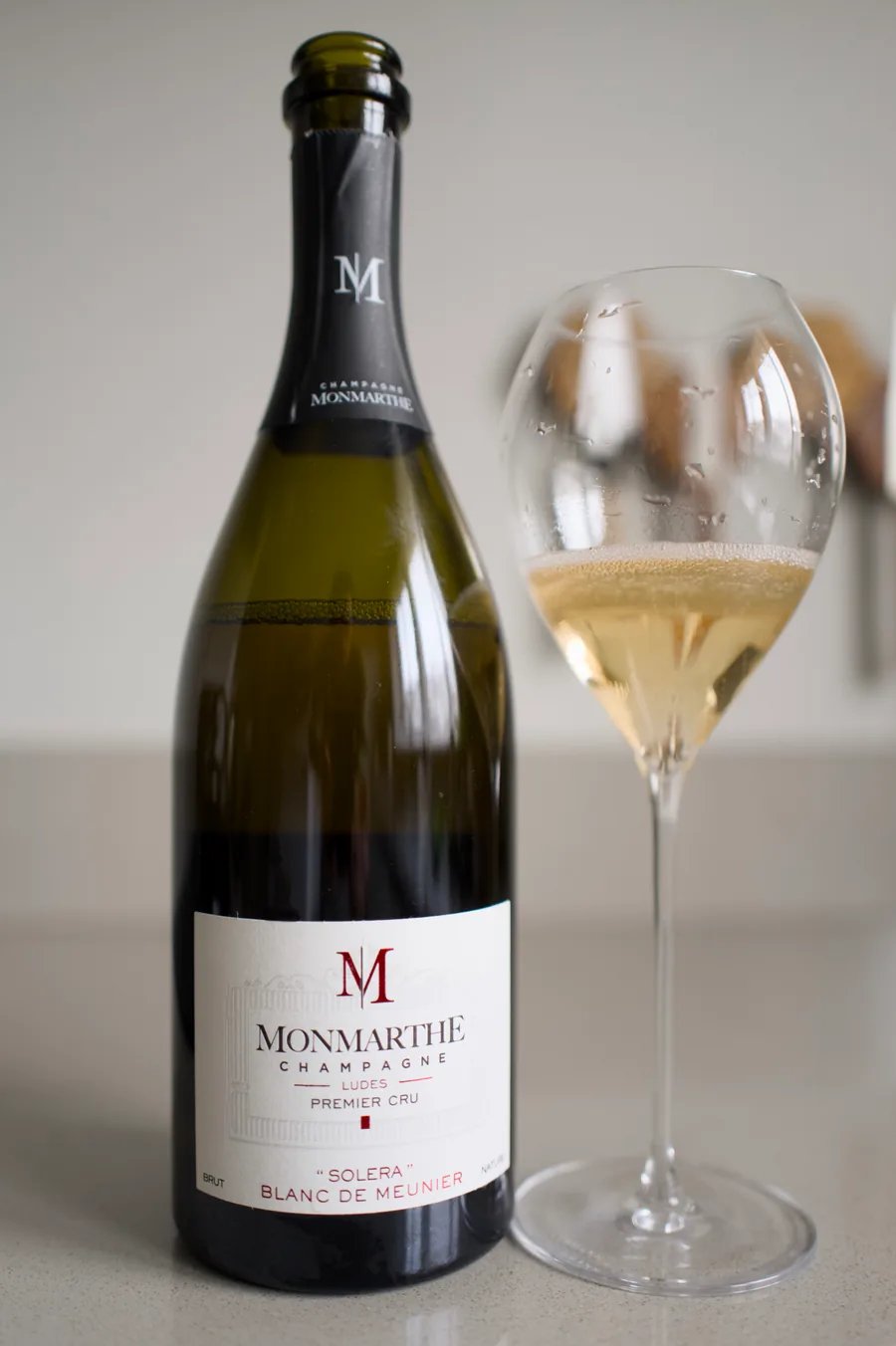 Bottle of Champagne Monmarthe Solera Blanc de Meunier with a glass
