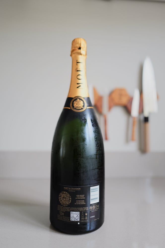 Back of the Moët & Chandon Brut Impérial magnum with QR code and the words 'Look Behind The Scenes Of Our Maison'