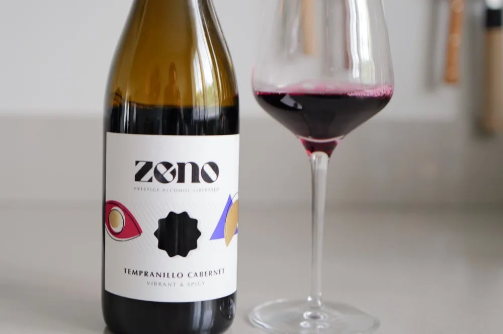 Bottle of Zeno Tempranillo Cabernet alcohol-free red wine beside a glass