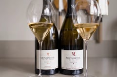 Two bottles of Champagne Monmarthe with glasses, Le Nid d'Agace and Solera Blanc de Meunier