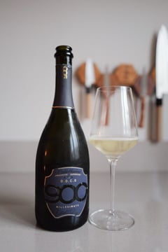 Bottle of 900wine DOCG Valdobbiadene Millesimato Prosecco with glass