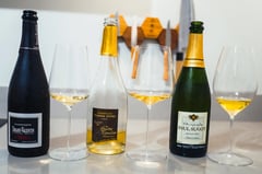 Small champagne grower with bottles and tasting glasses
