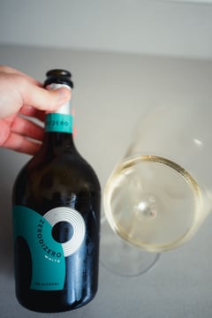 Bottle of Zero di Zero non-alcoholic sparkling wine on a tasting table