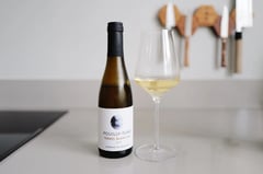 Half bottle of Pouilly-Fumé Terres Blanches 2023 from Domaine du Bouchot beside a poured glass