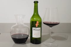 Bottle of Colección Vivanco 4 Varietales 2019 Rioja beside a decanter and a glass of red wine