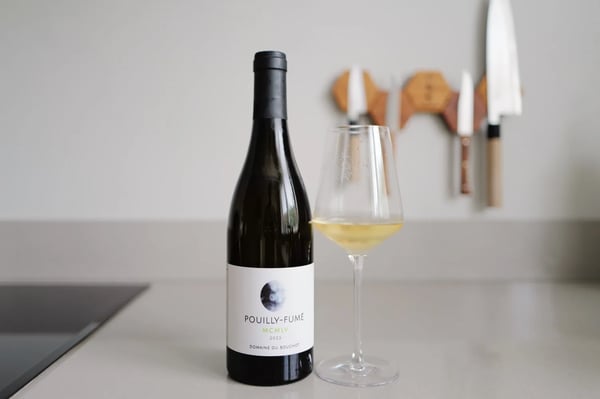 Bottle of Pouilly-Fumé MCMLV 2023 from Domaine du Bouchot beside a poured glass