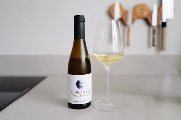 Half bottle of Pouilly-Fumé Terres Blanches 2023 from Domaine du Bouchot beside a poured glass